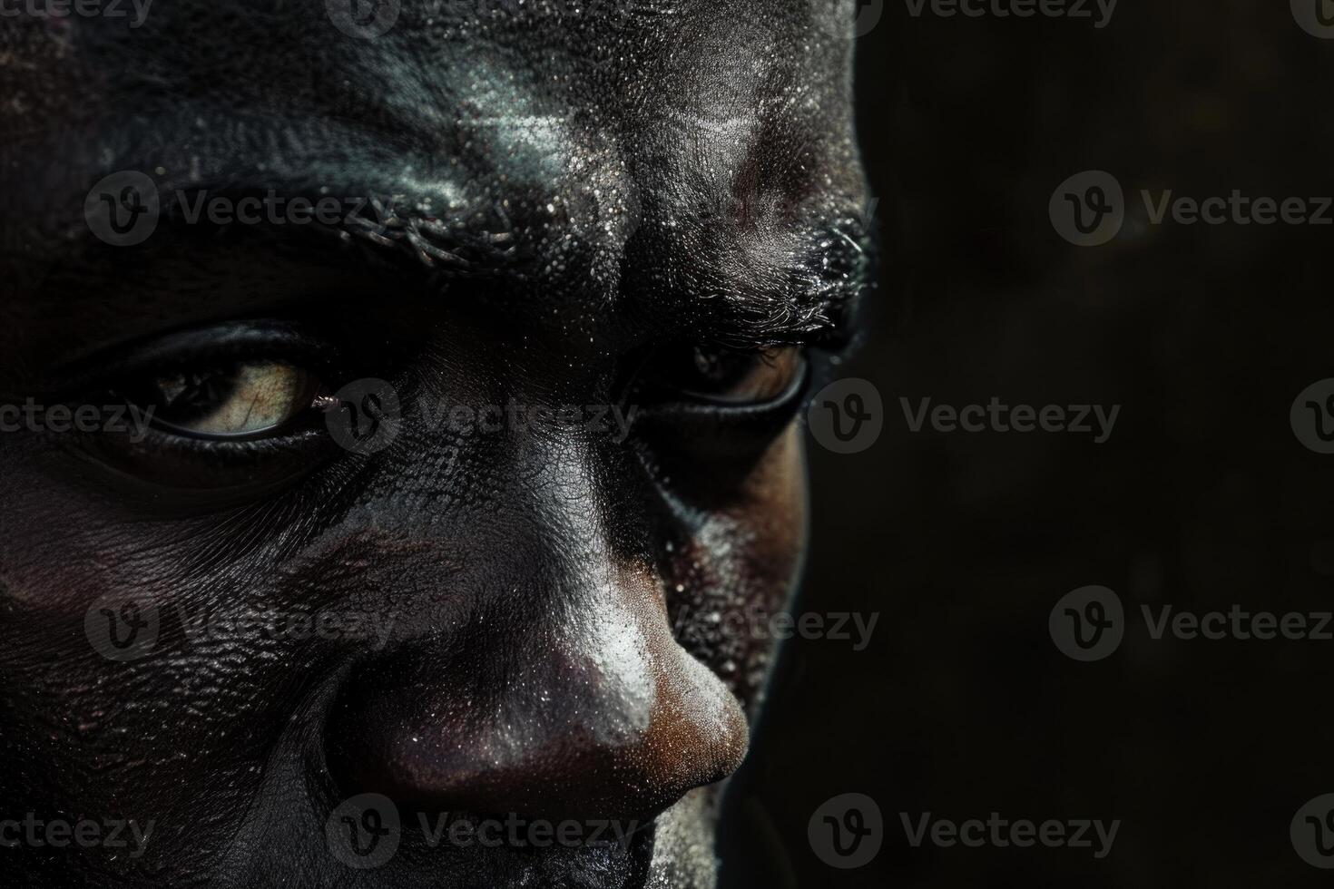 Close up portrait of african miner covered in coal dust photo