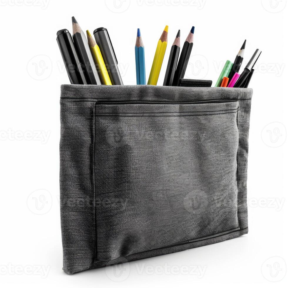 Gray pencil case bursting with colorful writing instruments on white background photo