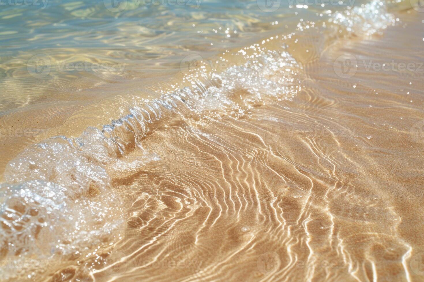 Soft wave washing golden sand on tropical beach photo