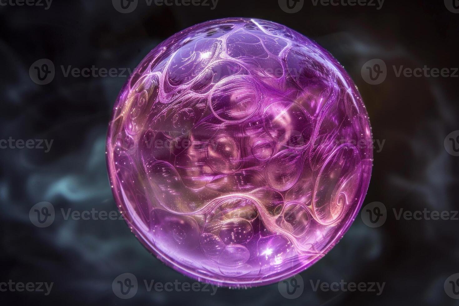 Purple and gold plasma ball glowing in the dark photo