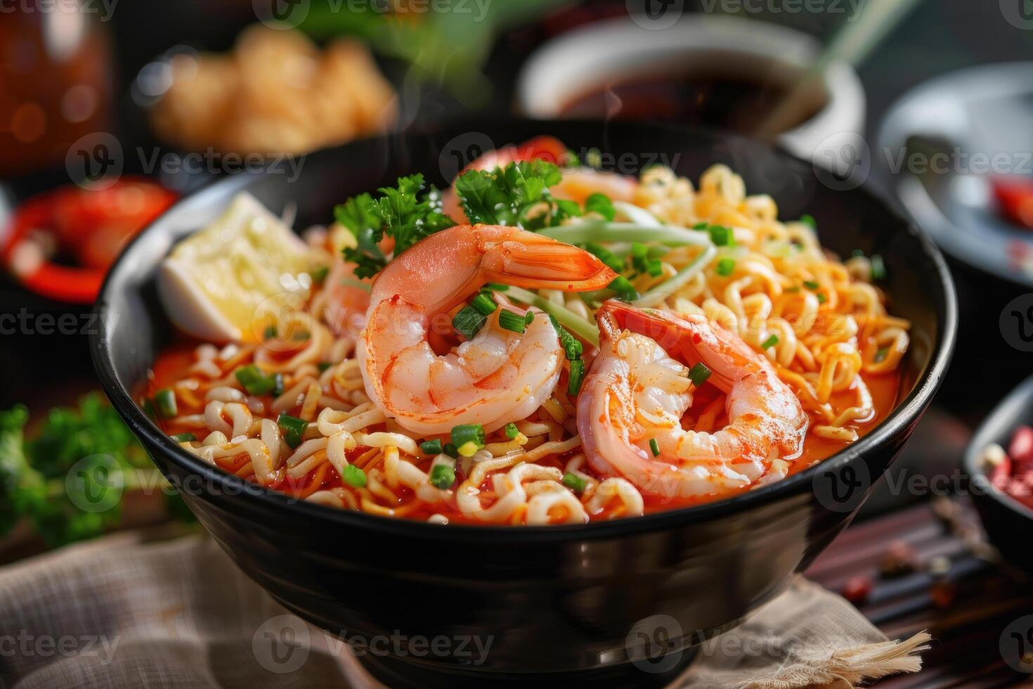 Steaming hot shrimp ramen noodle soup with egg and herbs photo