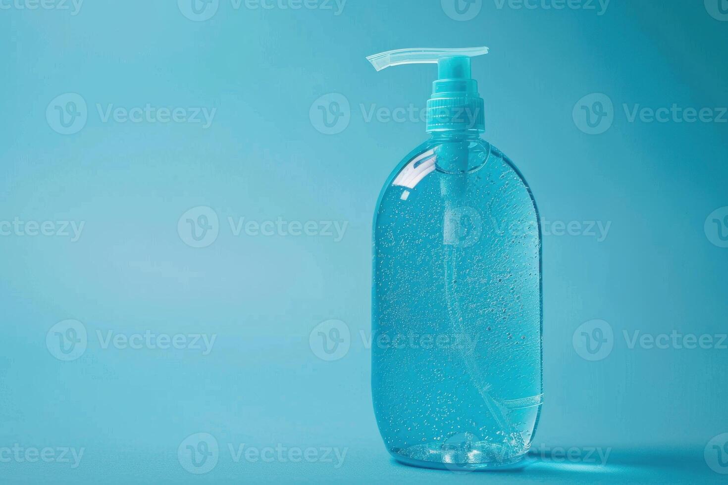 Sanitizer gel bottle on blue background promoting hygiene and cleanliness photo