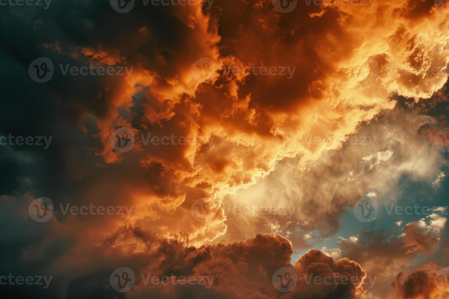 Dramatic orange and grey clouds creating a stunning sunset sky photo