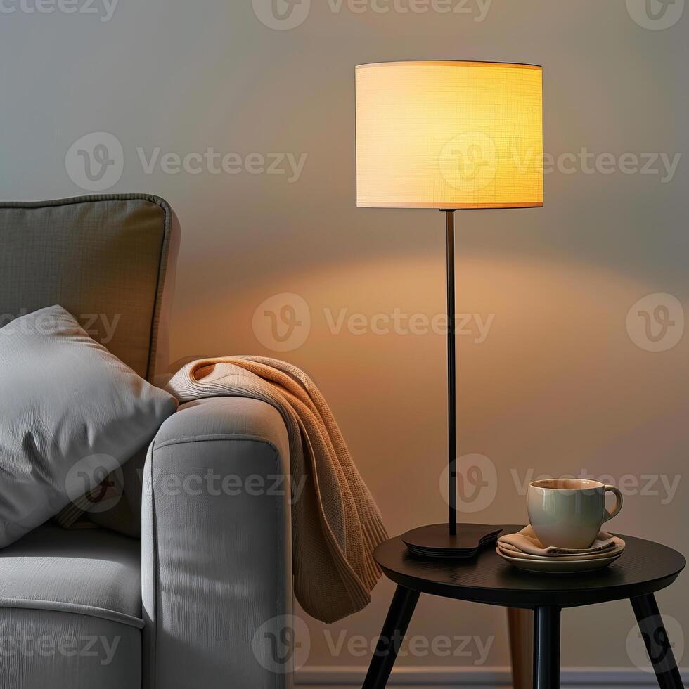 Modern floor lamp illuminating cozy living room with sofa and coffee table photo