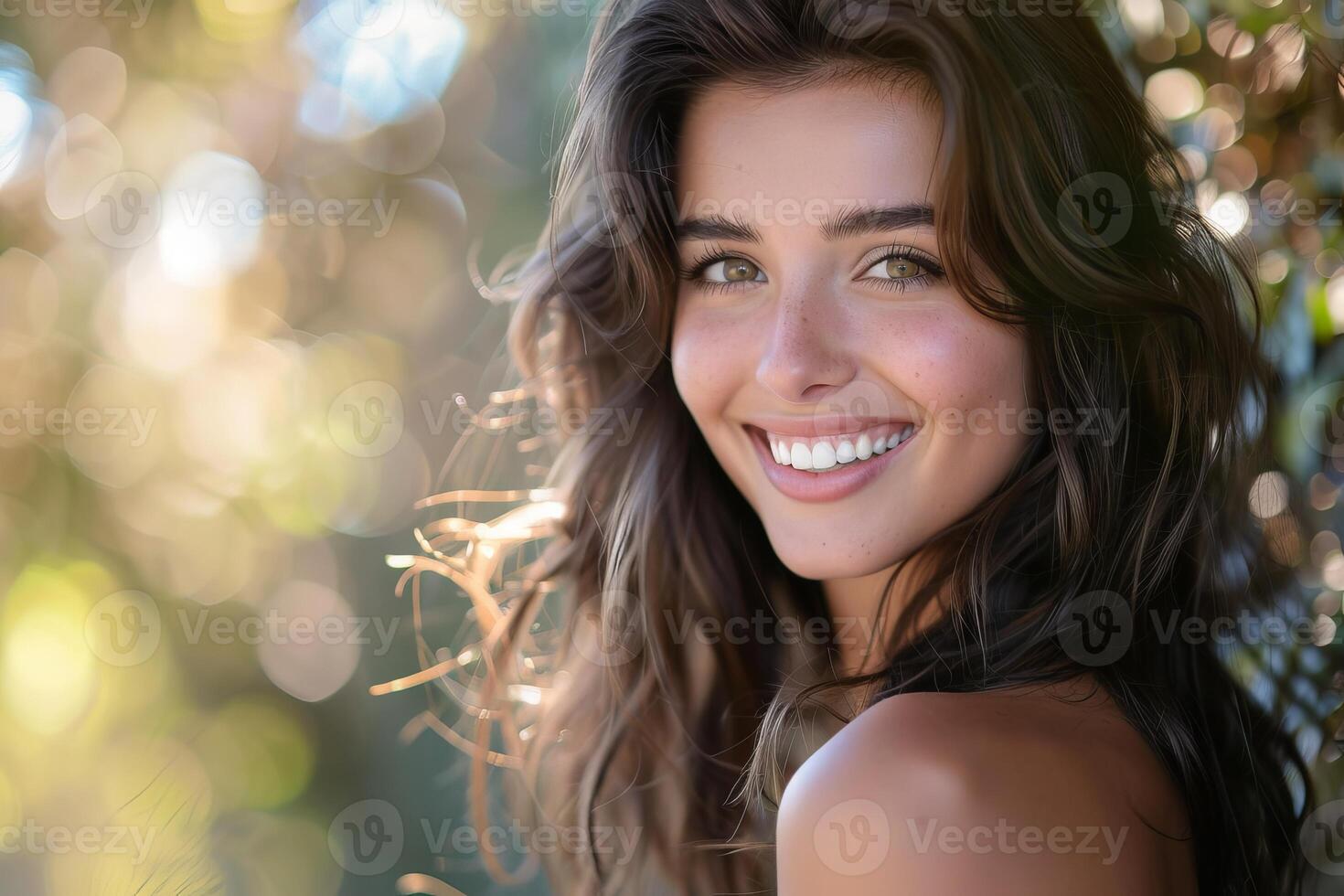 Beautiful smiling model posing outdoors with bokeh background photo