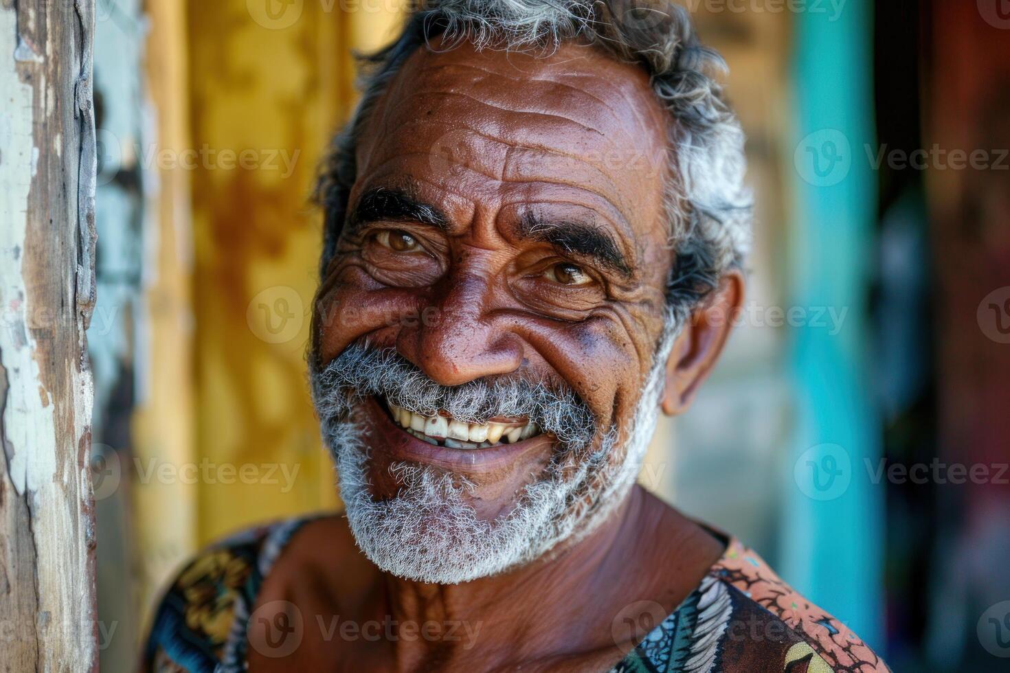 Portrait of smiling senior man expressing happiness and joy photo