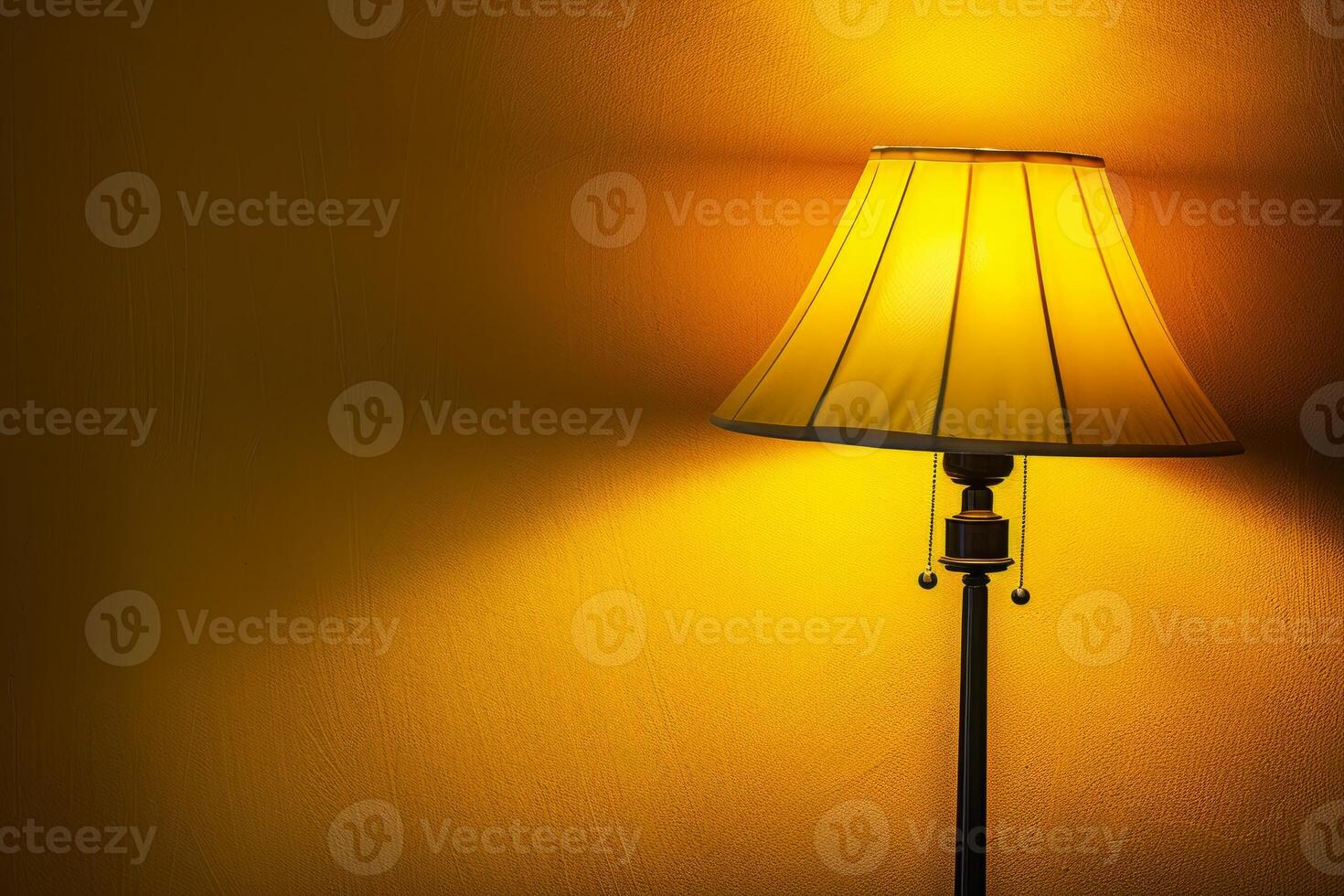 Floor lamp illuminating yellow wall creating warm atmosphere photo