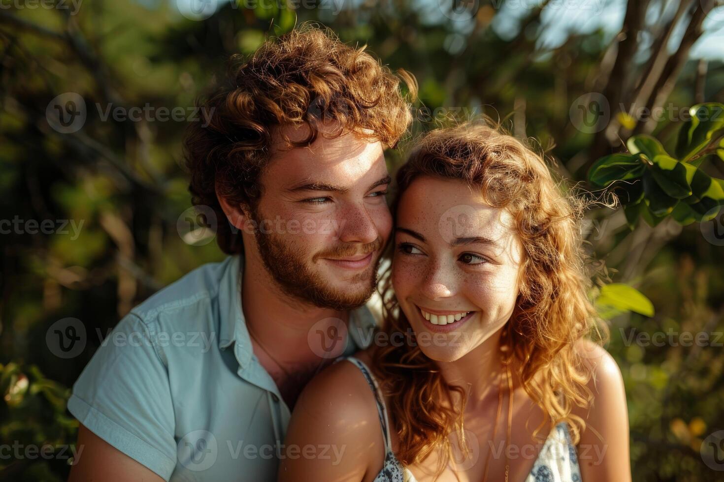 Happy couple smiling and enjoying time together outdoors in nature photo