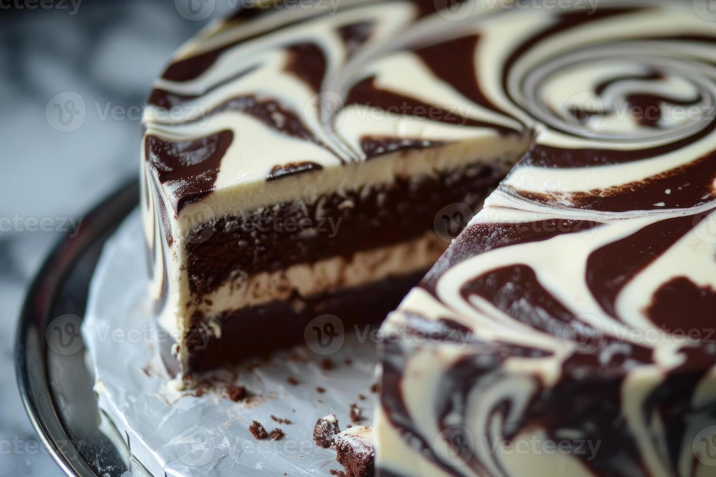 Delicious chocolate and vanilla swirl cake showing inside layers on silver tray photo
