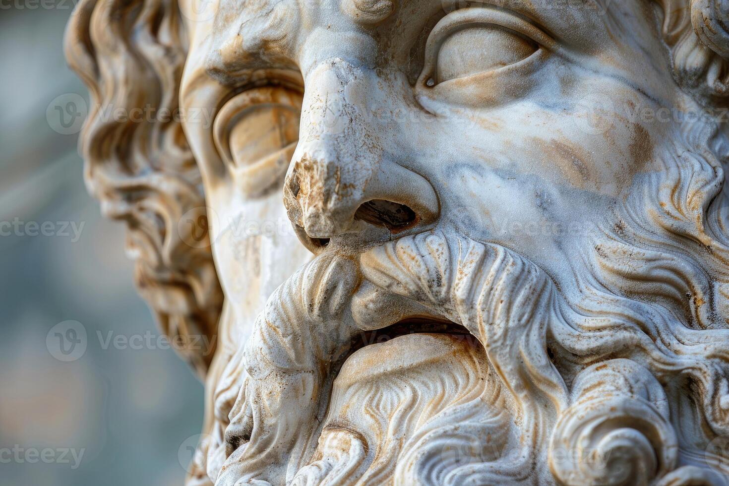 Marble statue face showing intricate details and weathering from time photo