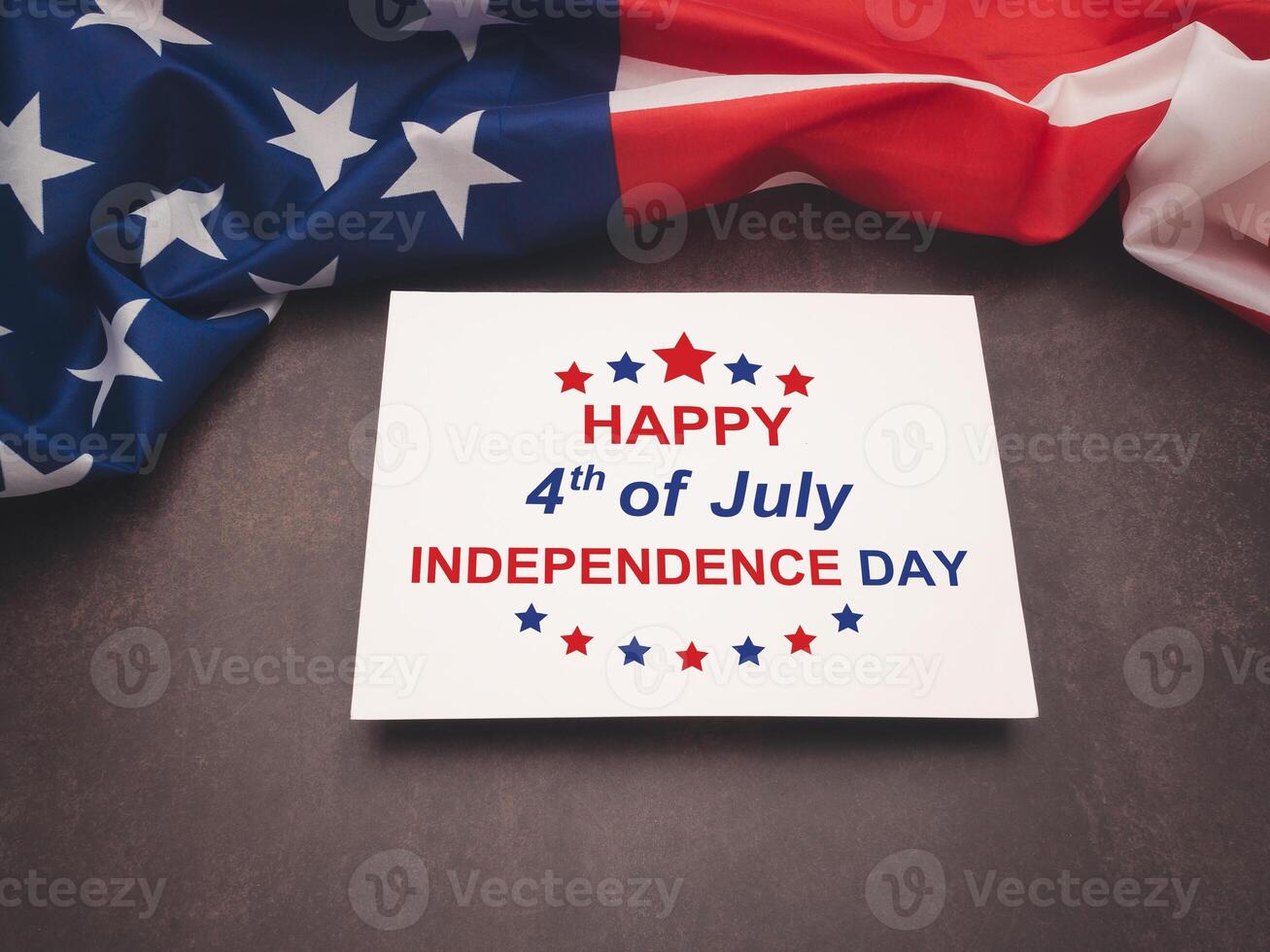 American flag and the text of Happy 4th of July Independence day on a white paper over the vintage background photo