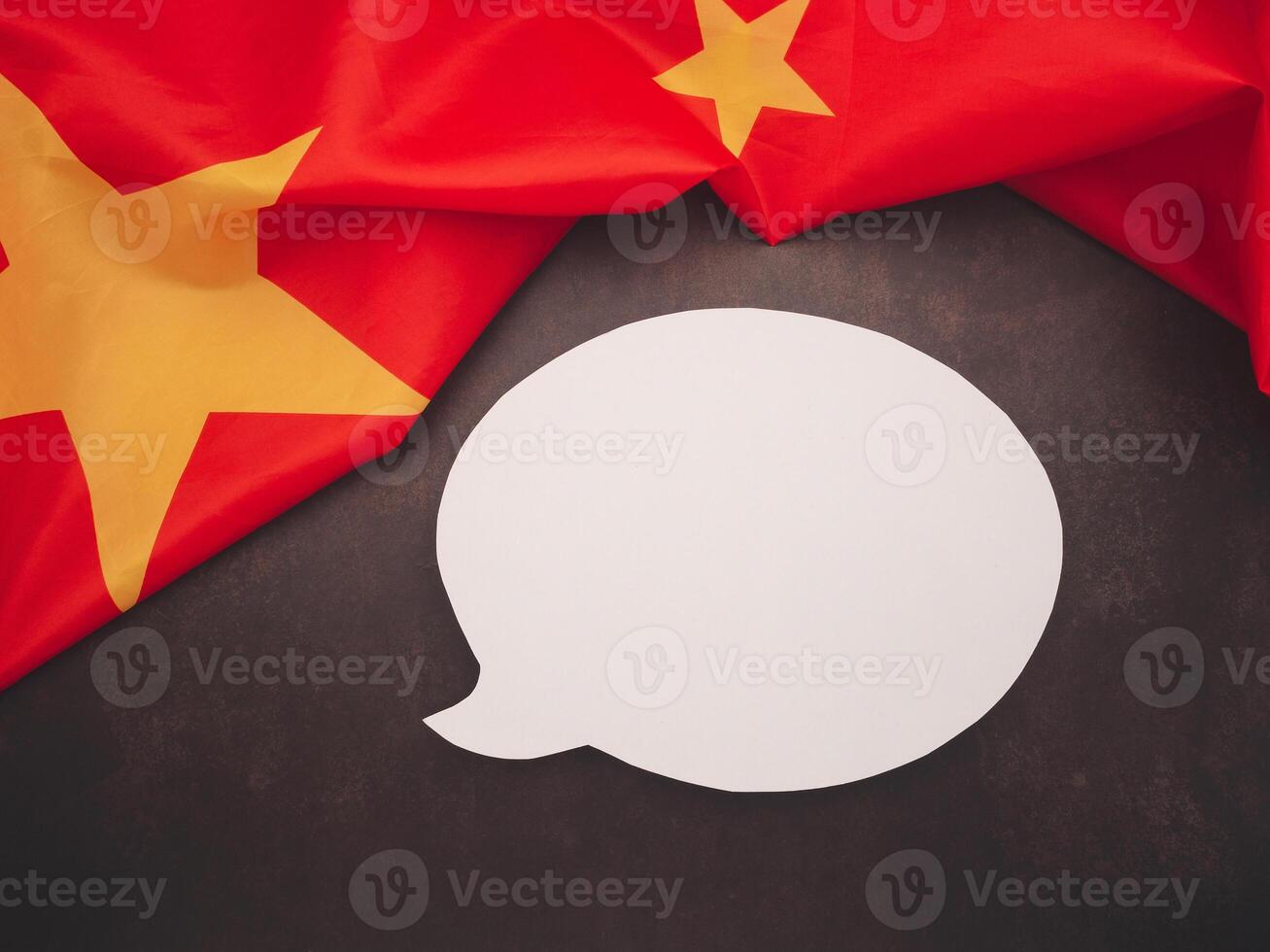 Part of the China flag and white speech bubble on a vintage background photo