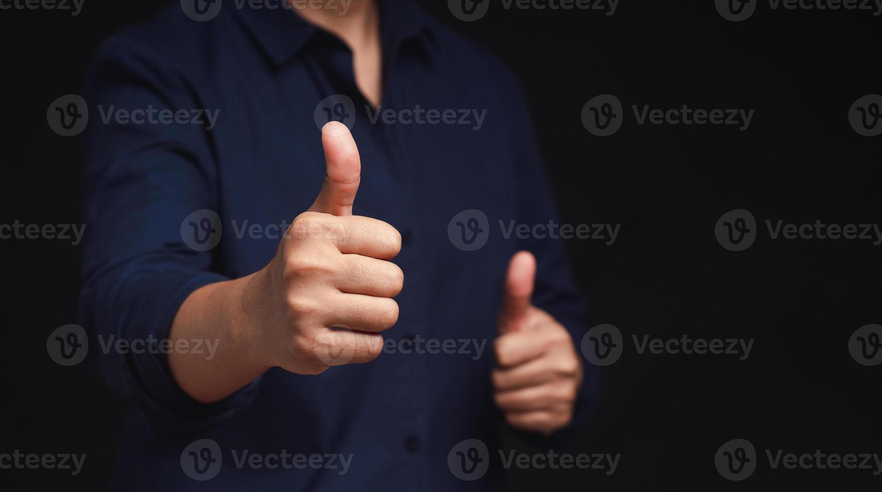 Close up of a man hand with thumbs up for best excellent services satisfaction photo