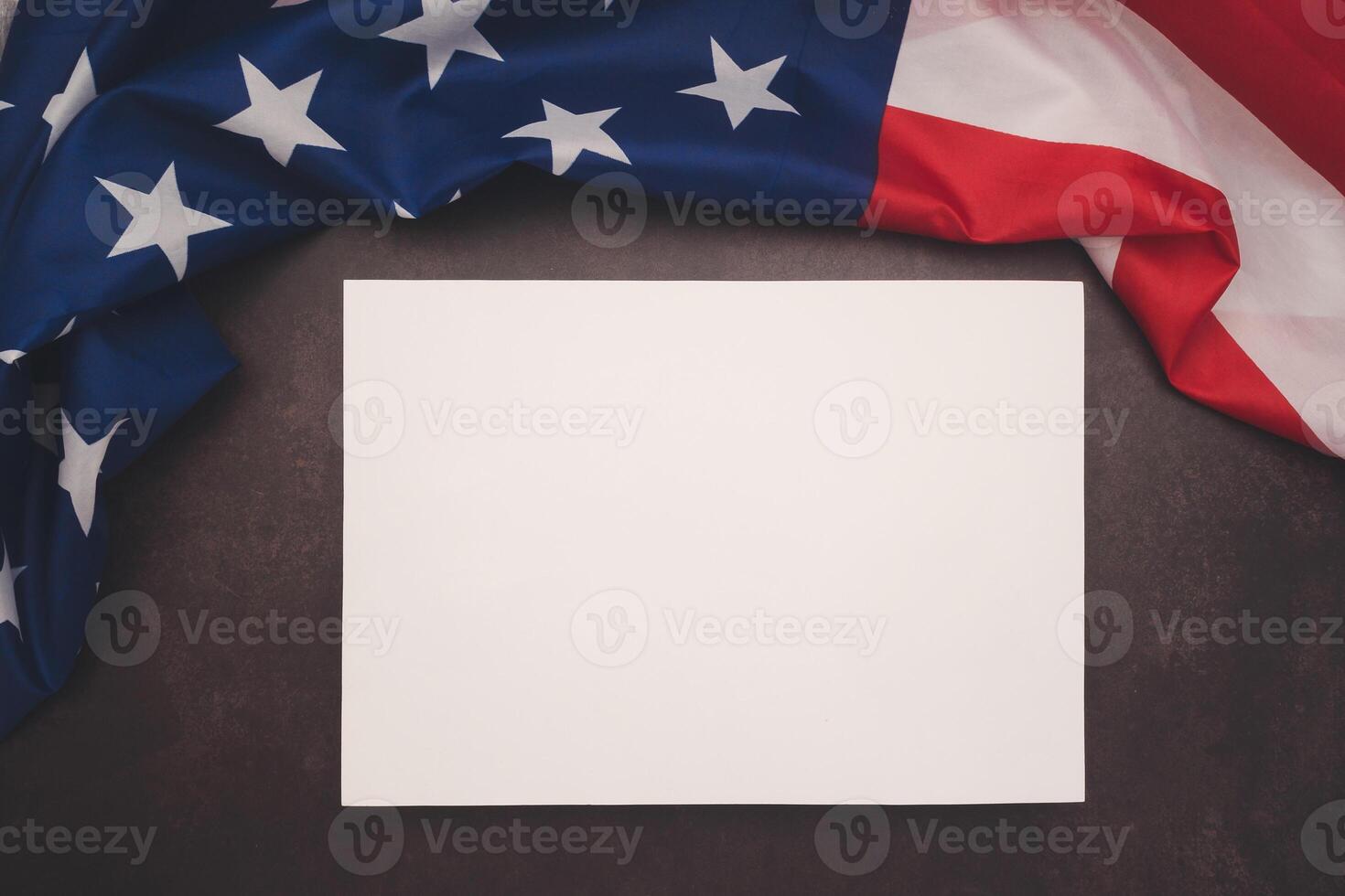 Part of the American flag and a blank white paper on a vintage background photo