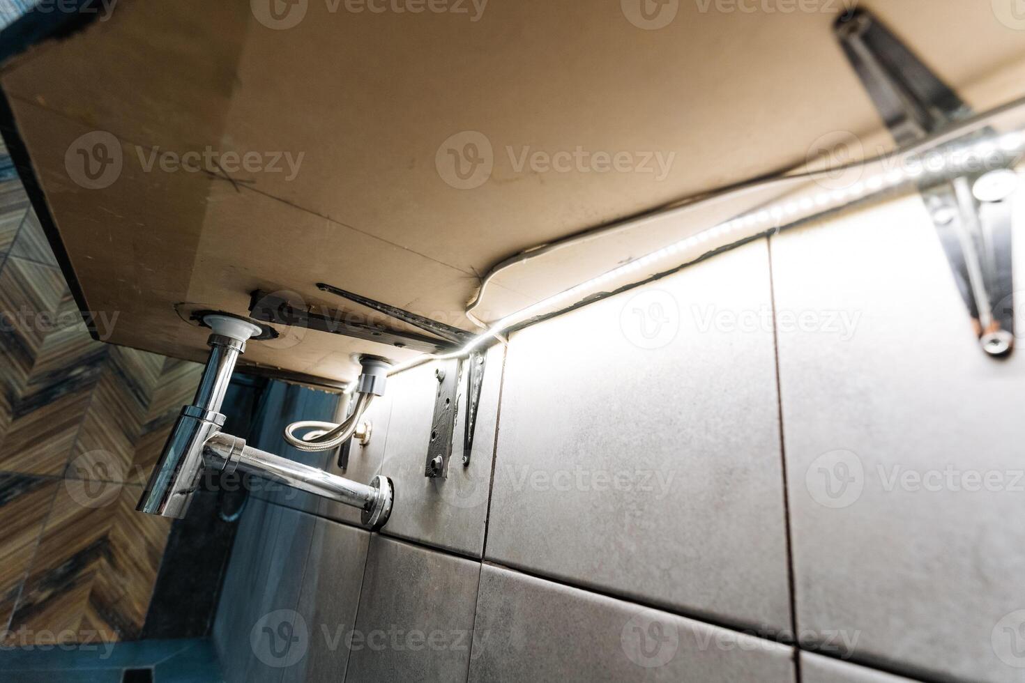 A camera hangs gracefully from the ceiling above, offering a distinct and captivating perspective that beautifully showcases and emphasizes all the various elements of the scene below photo