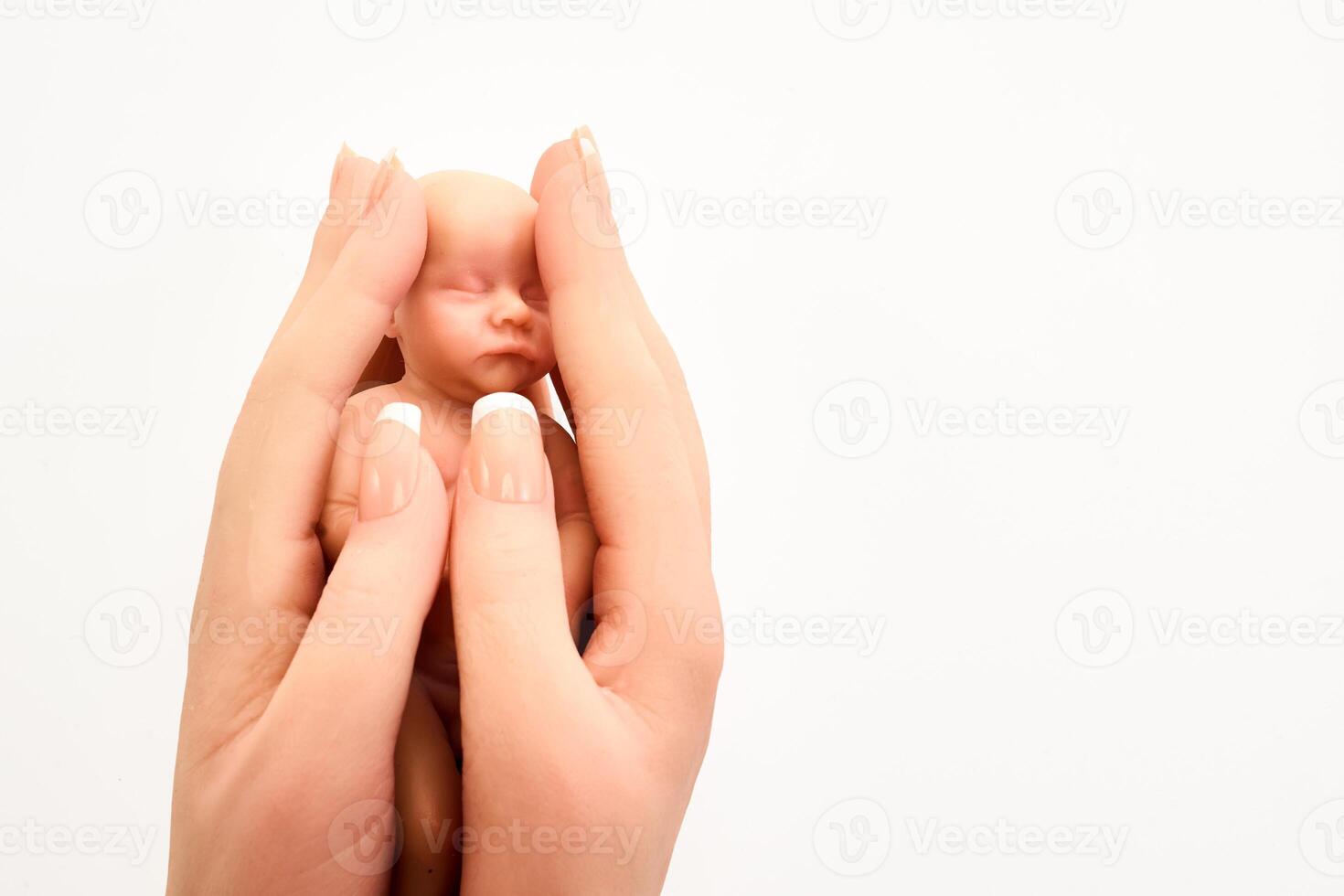 Tiny Baby in Gentle Hands photo