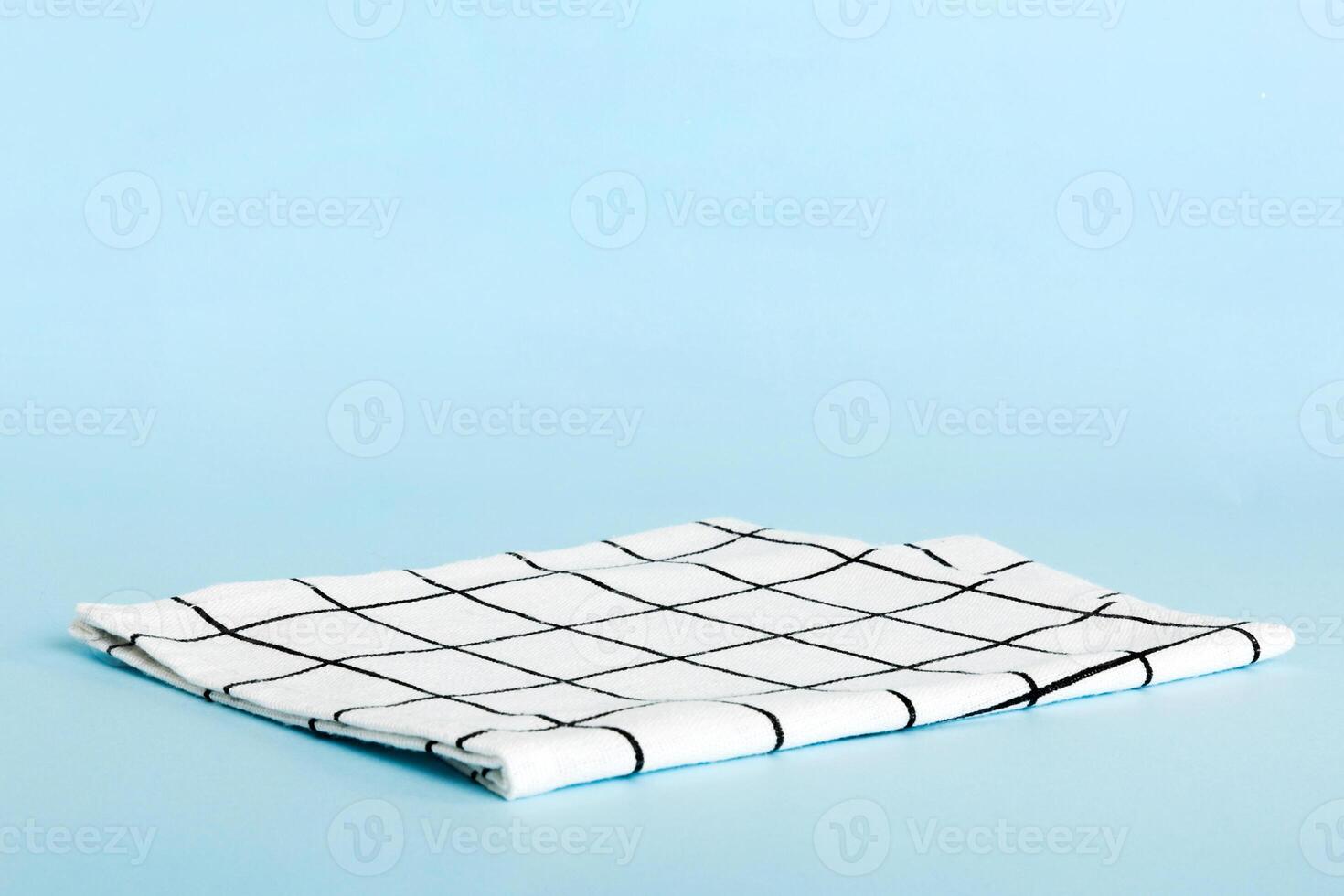 top view with white empty kitchen napkin isolated on table background. Folded cloth for mockup with copy space, style photo