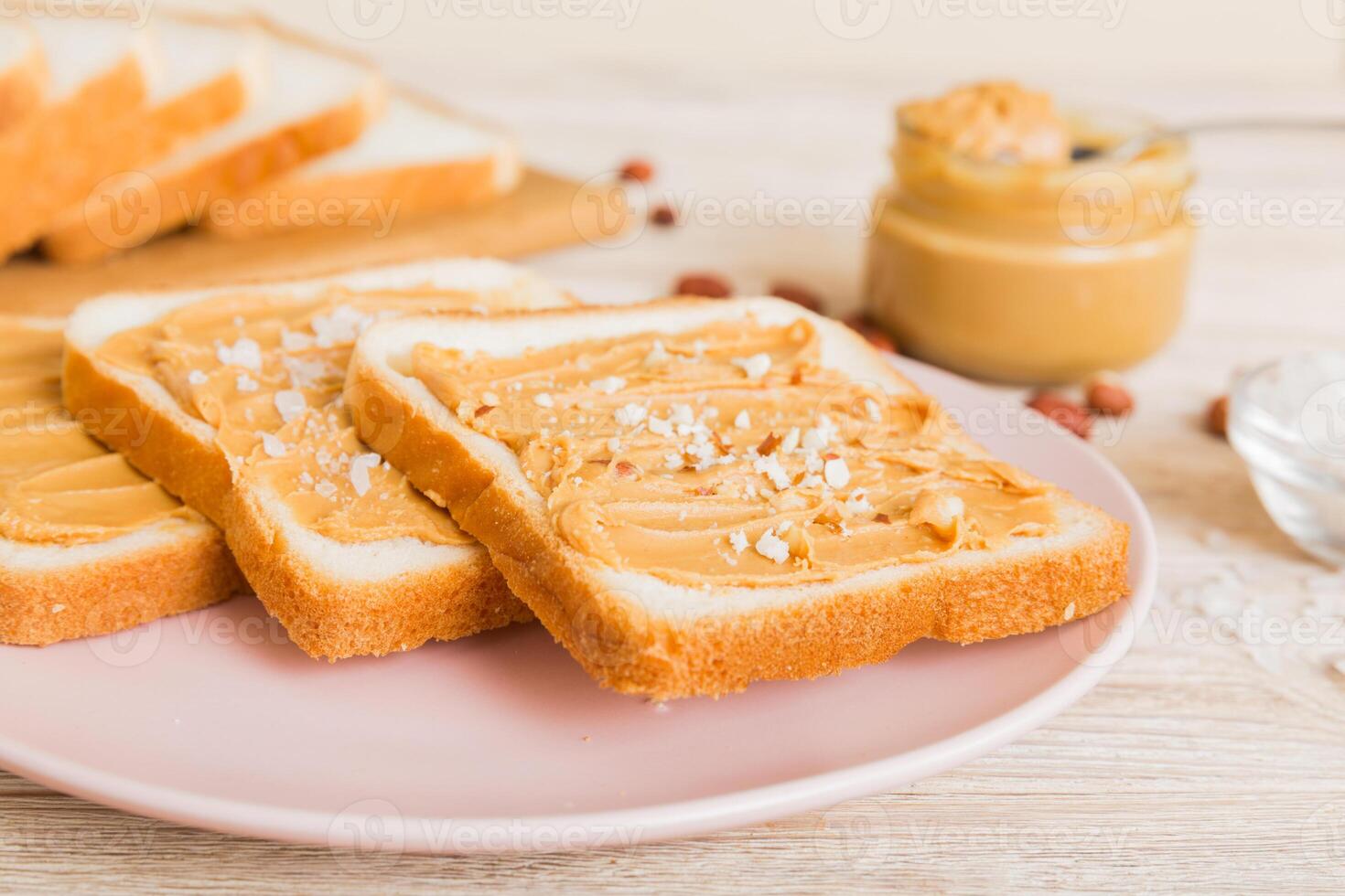 Peanut butter sandwiches toasts light table background.Breakfast. Vegetarian food. American cuisine photo