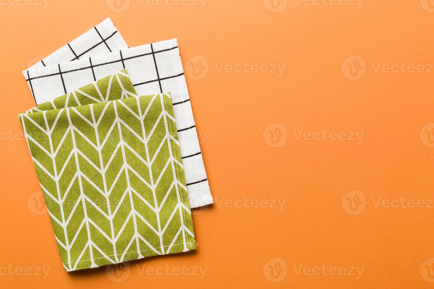 top view with green kitchen napkin isolated on table background. Folded cloth for mockup ,copy space photo
