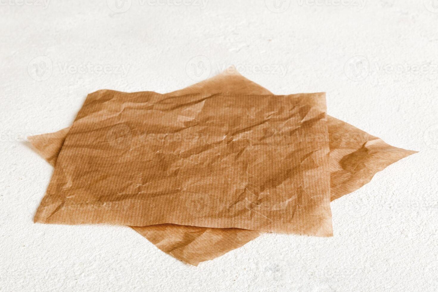 top view with baking parchment empty on table background. Folded cloth for mockup with copy space . Minimal style photo