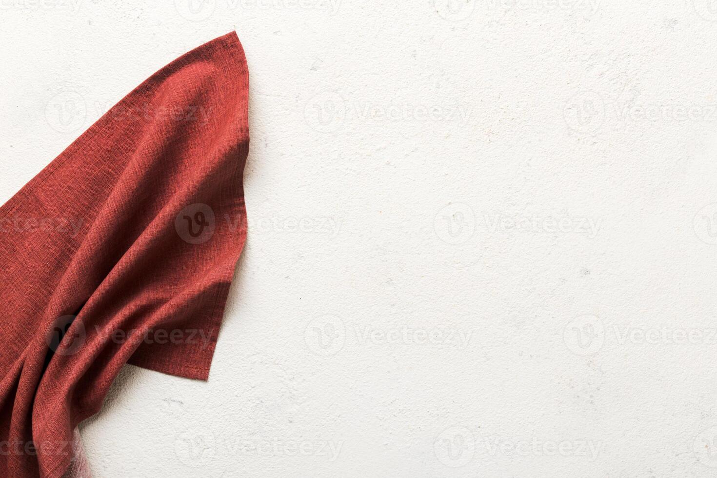 top view with red empty kitchen napkin isolated table background. Folded cloth for mockup with copy space, Minimal style photo