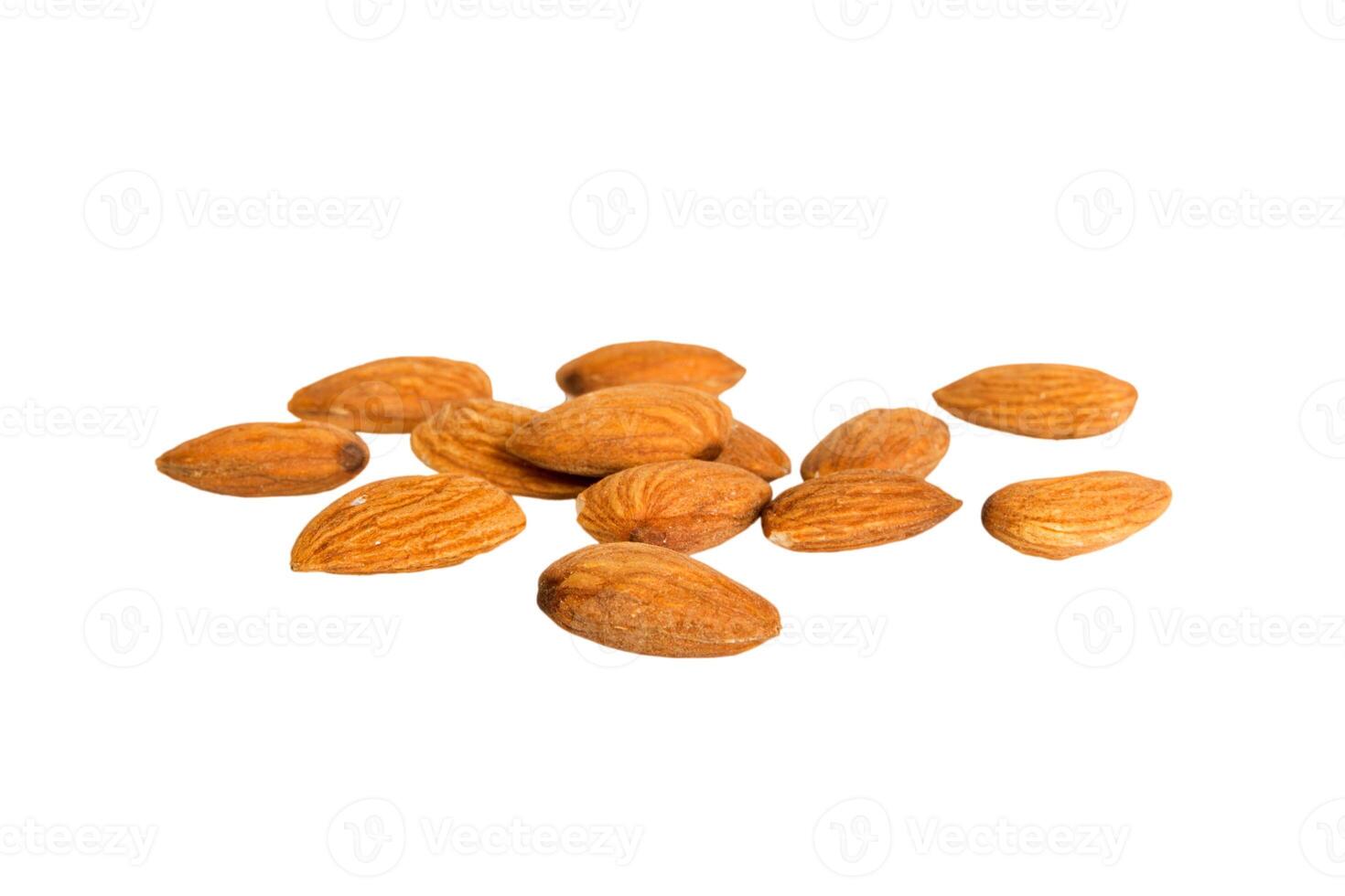 pile almonds isolated white background, top view. Flat lay Healthy food concept photo