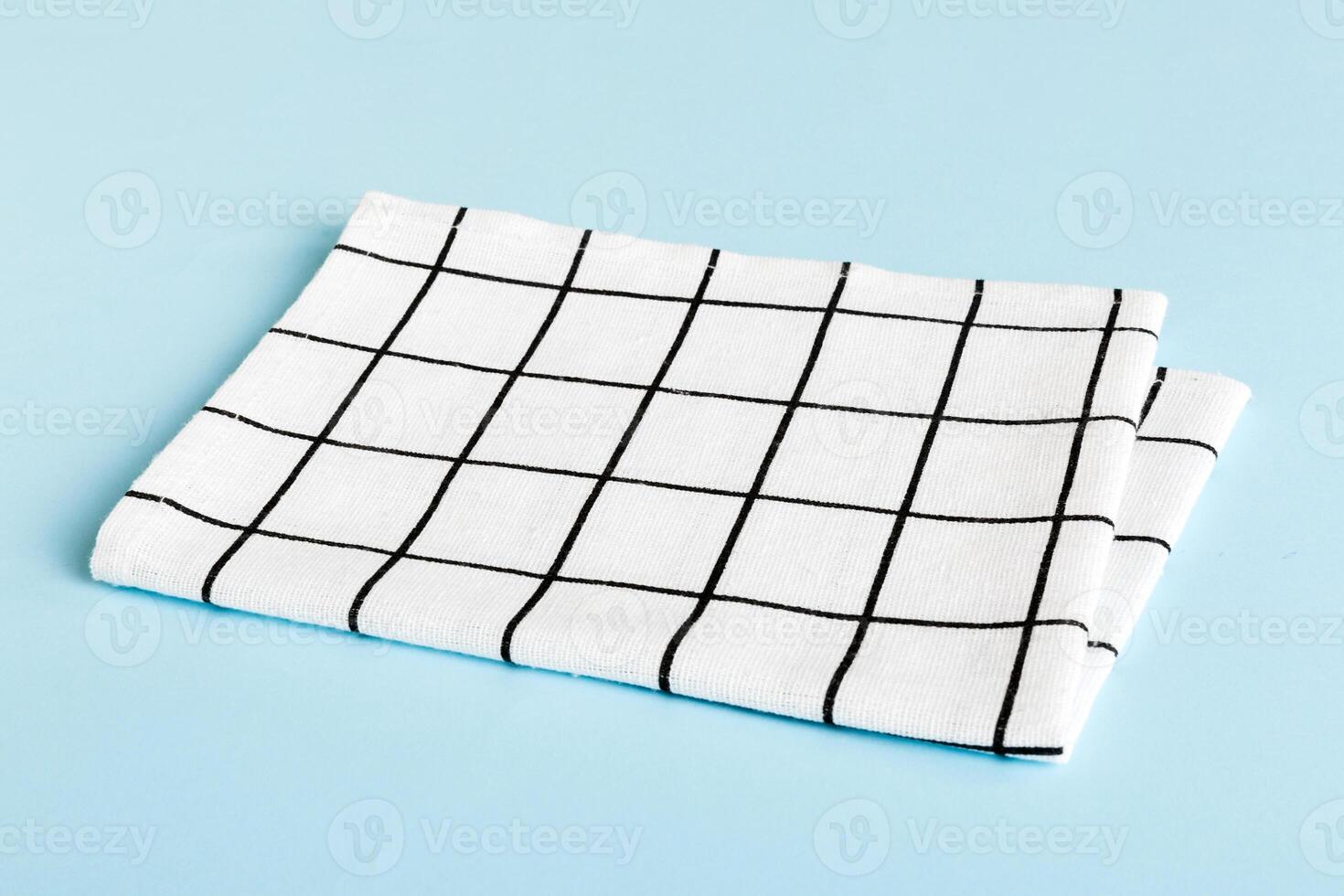 top view with white empty kitchen napkin isolated on table background. Folded cloth mockup with copy space, Minimal photo