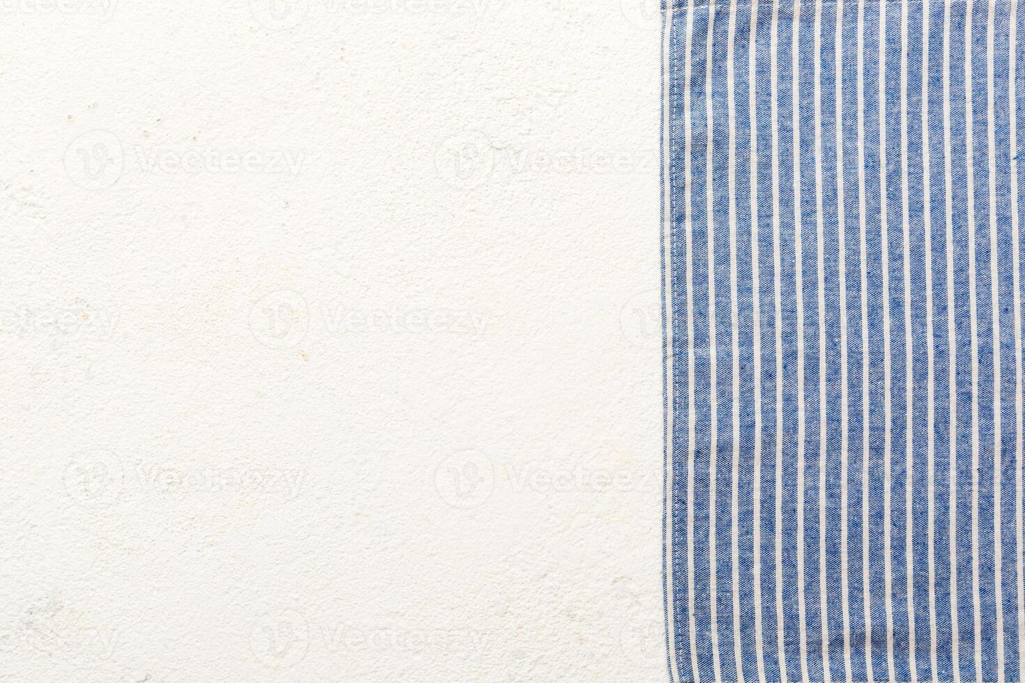 top view with blue kitchen napkin isolated table background. Folded cloth for mockup with copy space, Flat lay. Minimal style photo