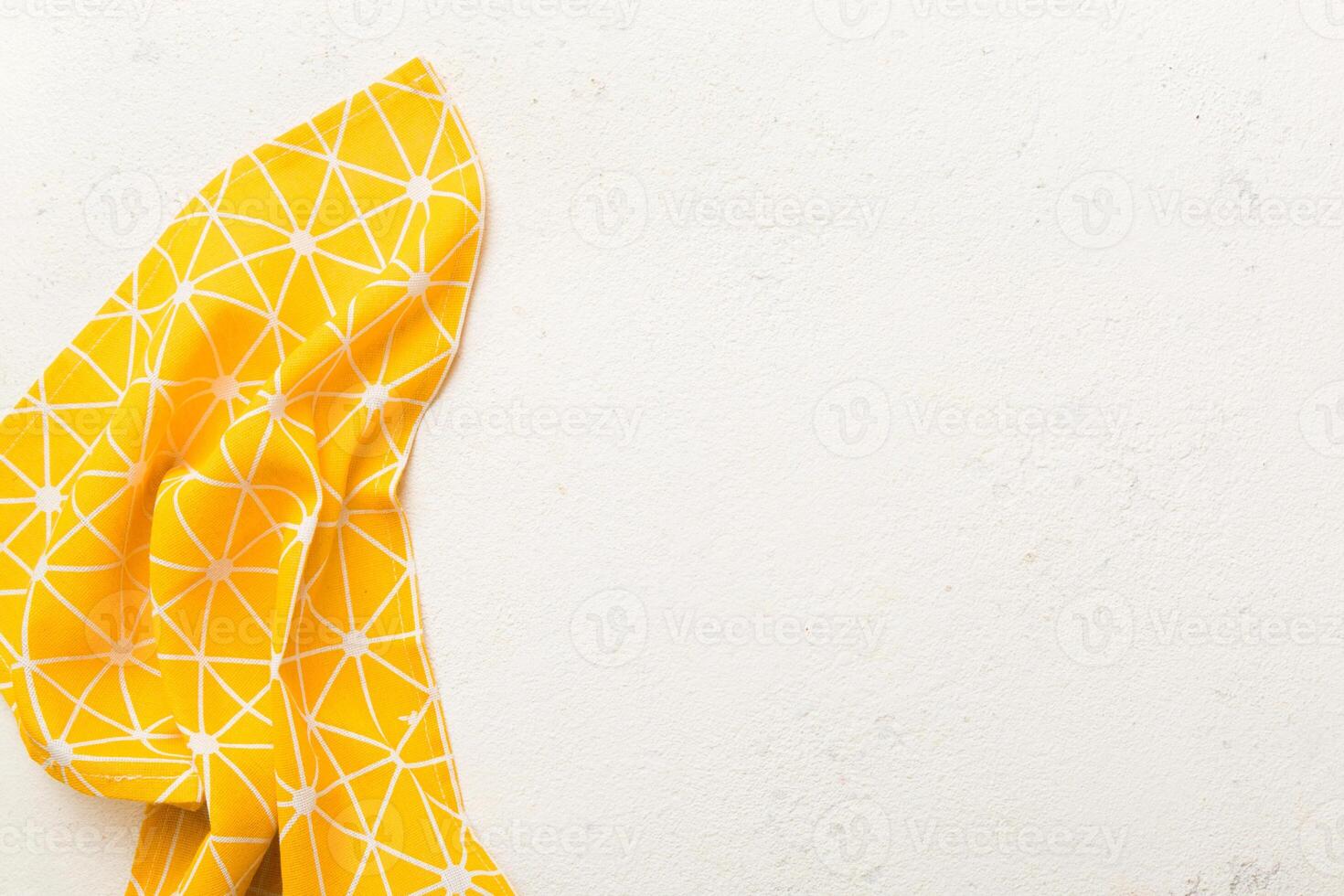 top view yellow empty kitchen napkin isolated on table background. Folded cloth for mockup with copy space, Flat lay. Minimal style photo