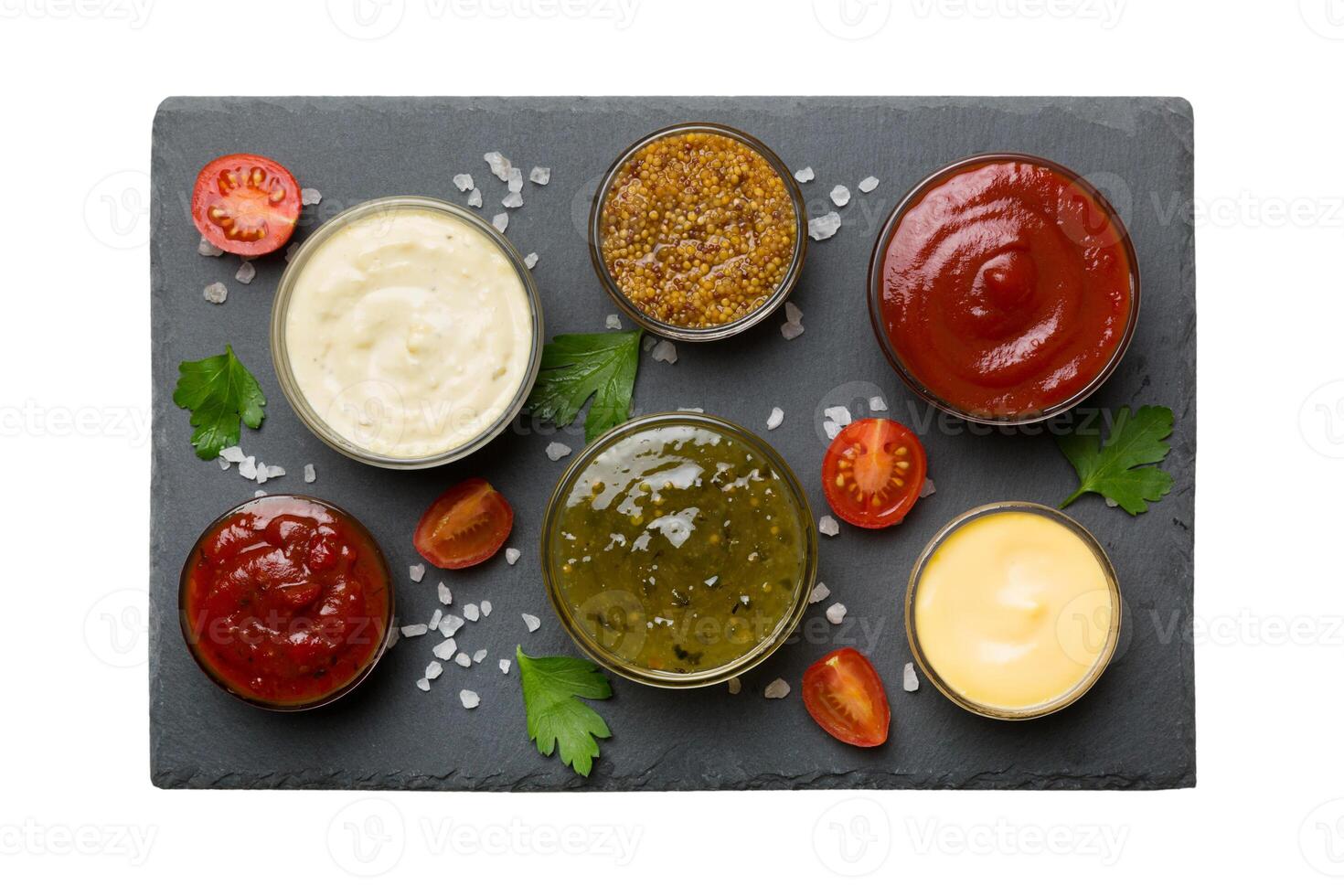 Many different sauces and herbs isolated white background, flat lay top view. sauces on plate, healthy concept photo