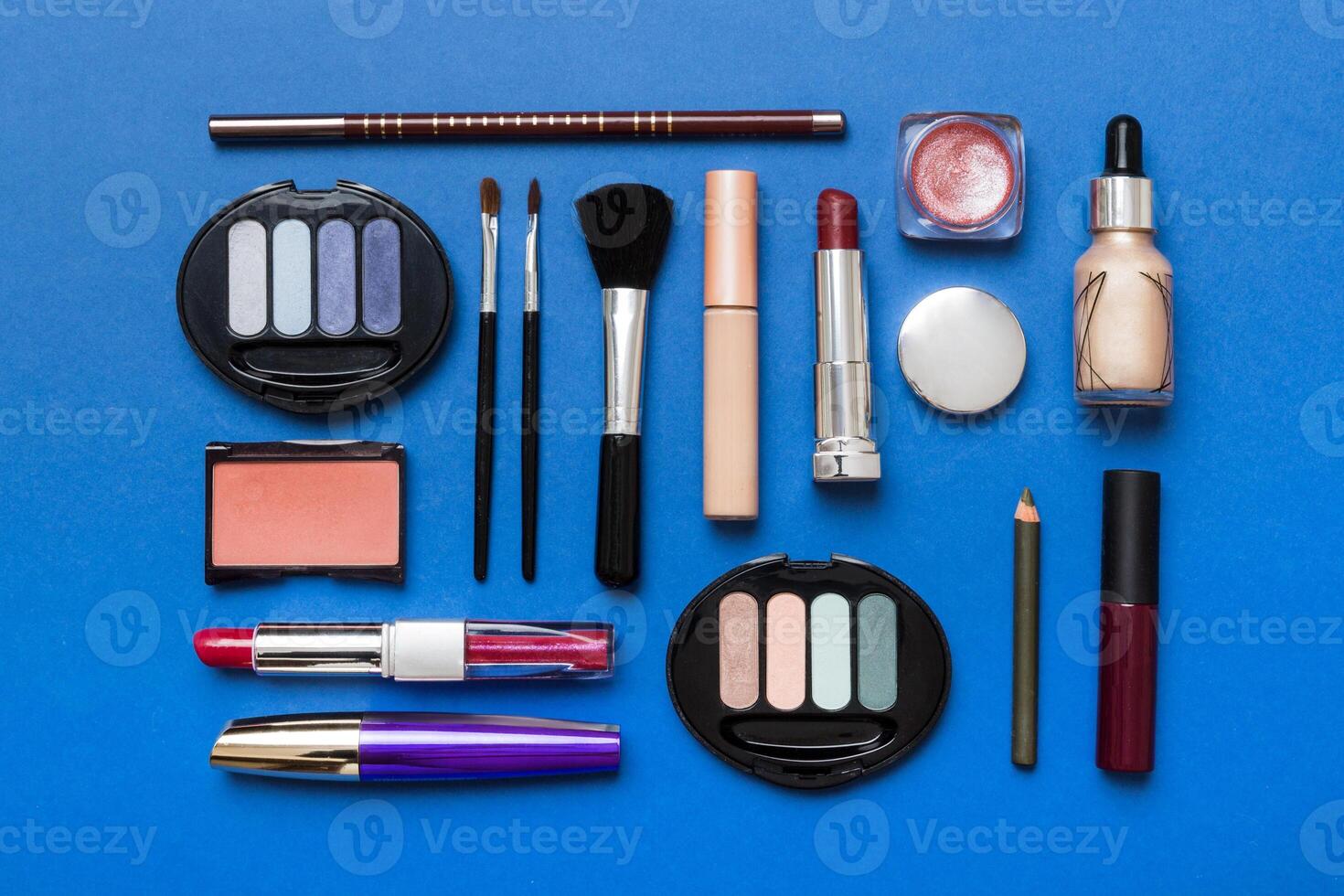 Professional makeup tools. Top view. Flat lay. Beauty, decorative cosmetics. Makeup brushes set and color eyeshadow palette on table . Minimalistic style photo