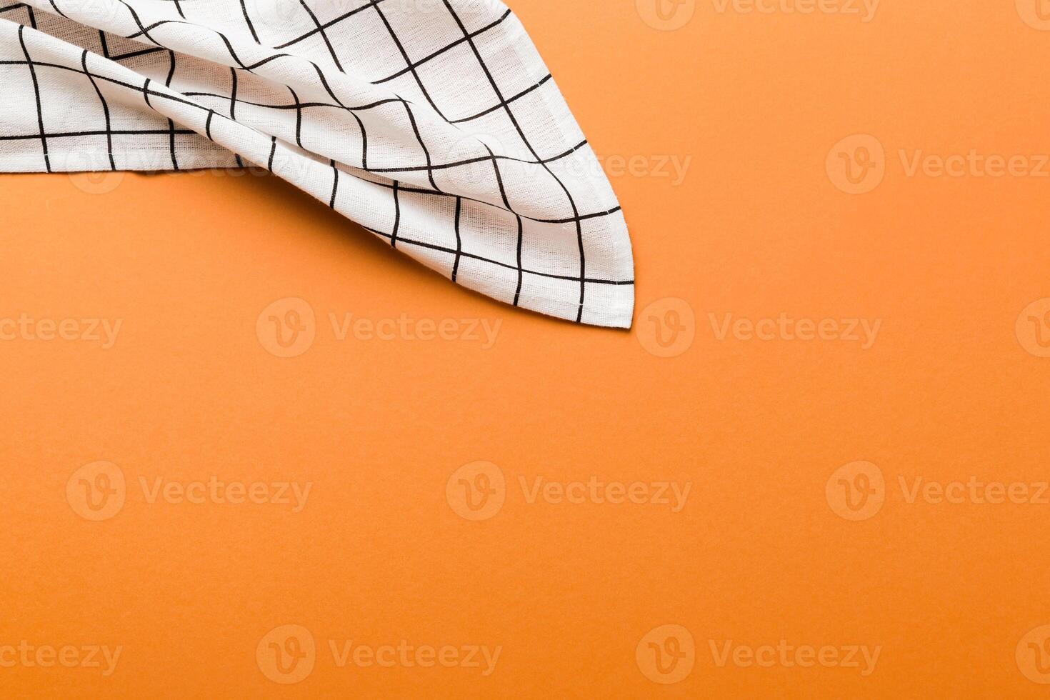 top view with white empty kitchen napkin isolated on table background. Folded cloth for mockup with copy space, Minimal style photo