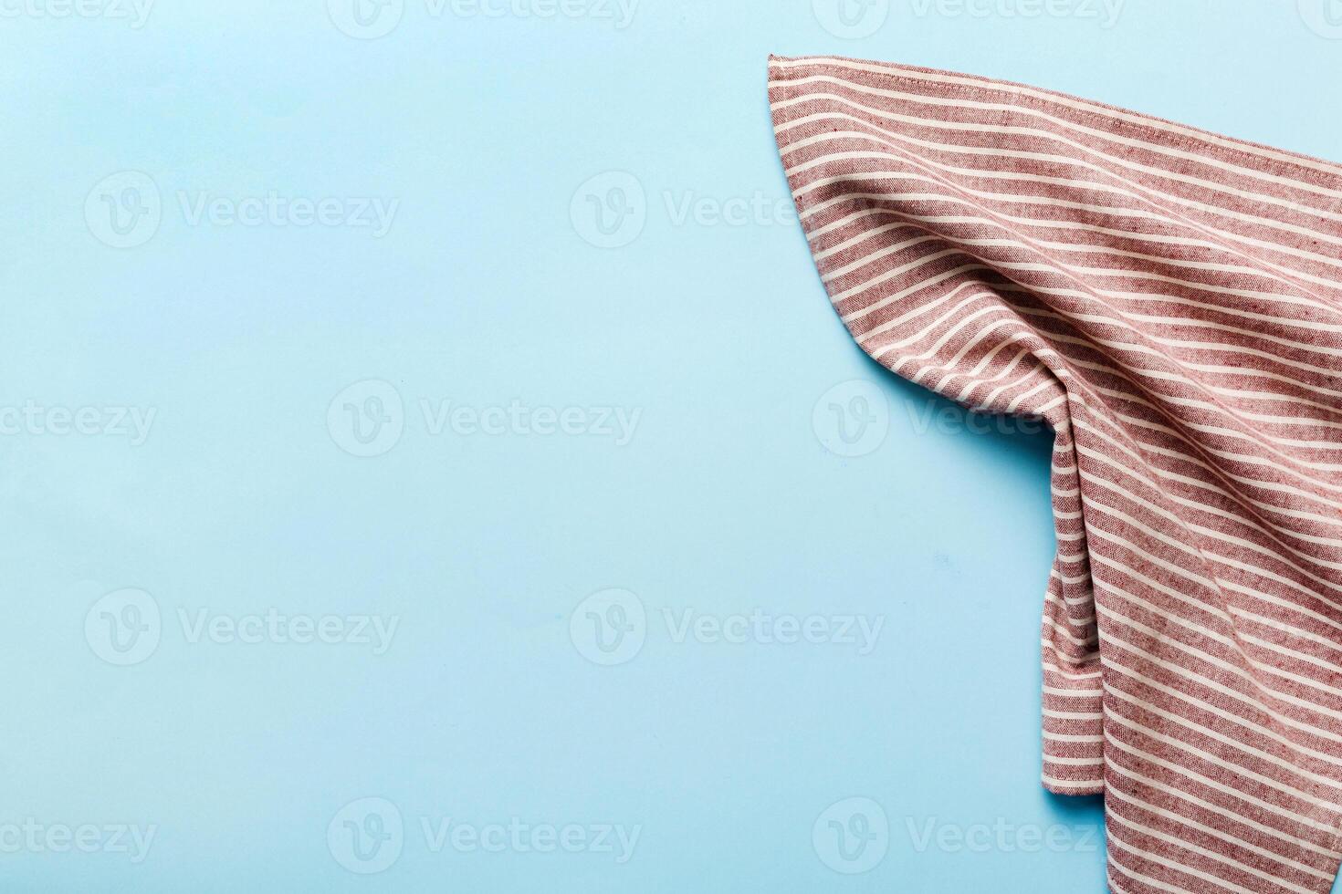 top view with red empty kitchen napkin isolated table background. Folded cloth for mockup with copy space. Minimal style photo