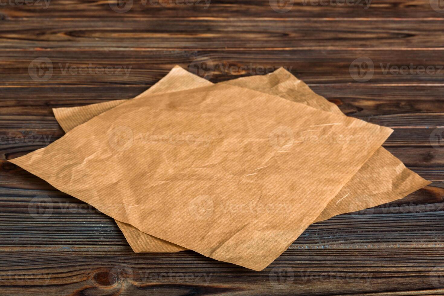 top view with baking parchment empty on table background. Folded cloth for mockup with copy space, Minimal style photo