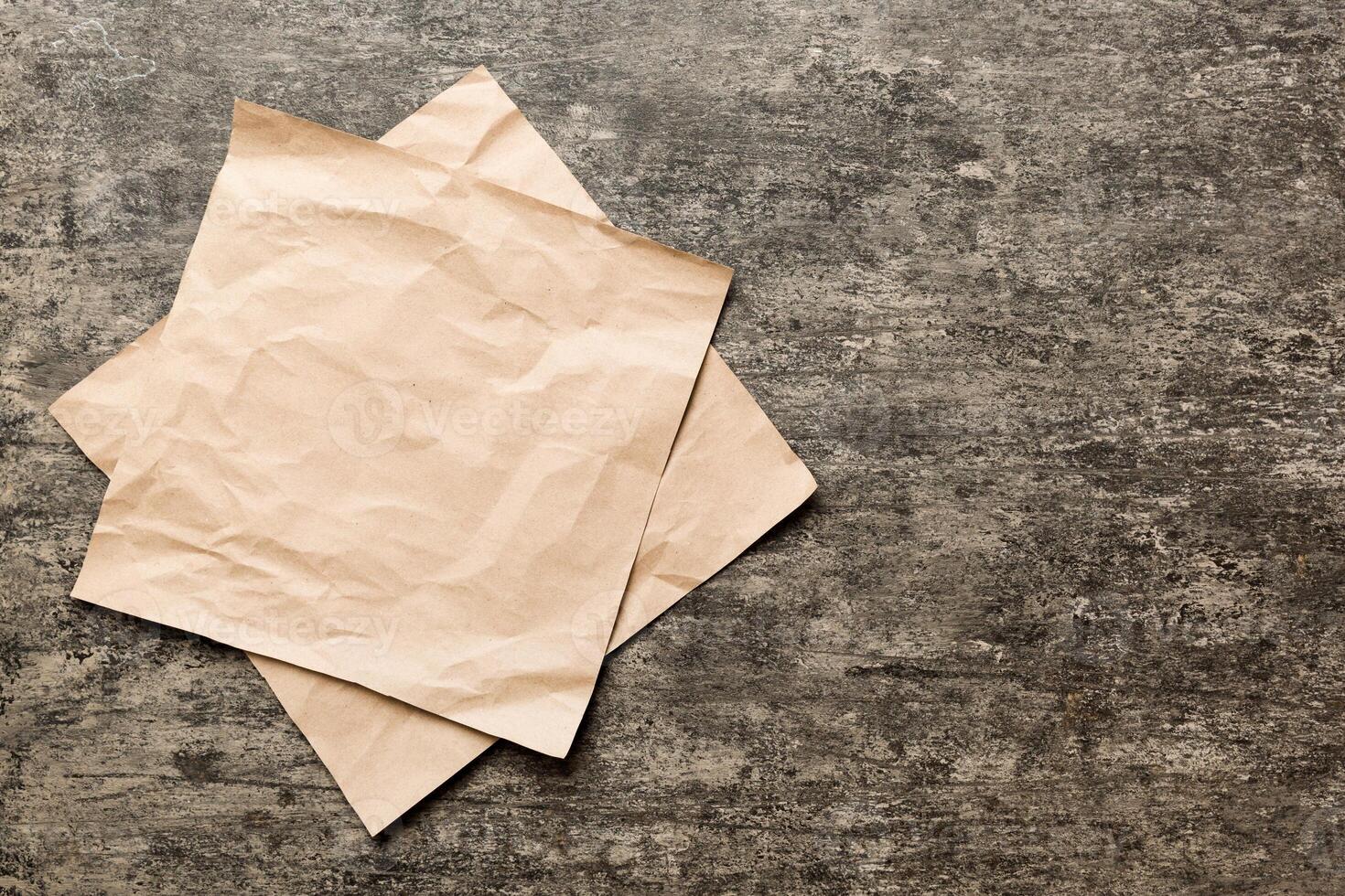 top view with baking parchment empty on table background. Folded cloth for mockup with copy space. Minimal style photo