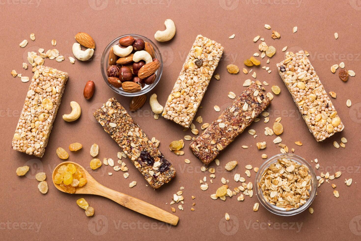 Various granola bars table background.Cereal granola bars. Superfood breakfast bars with oats, nuts and berries, close up. Superfood concept photo