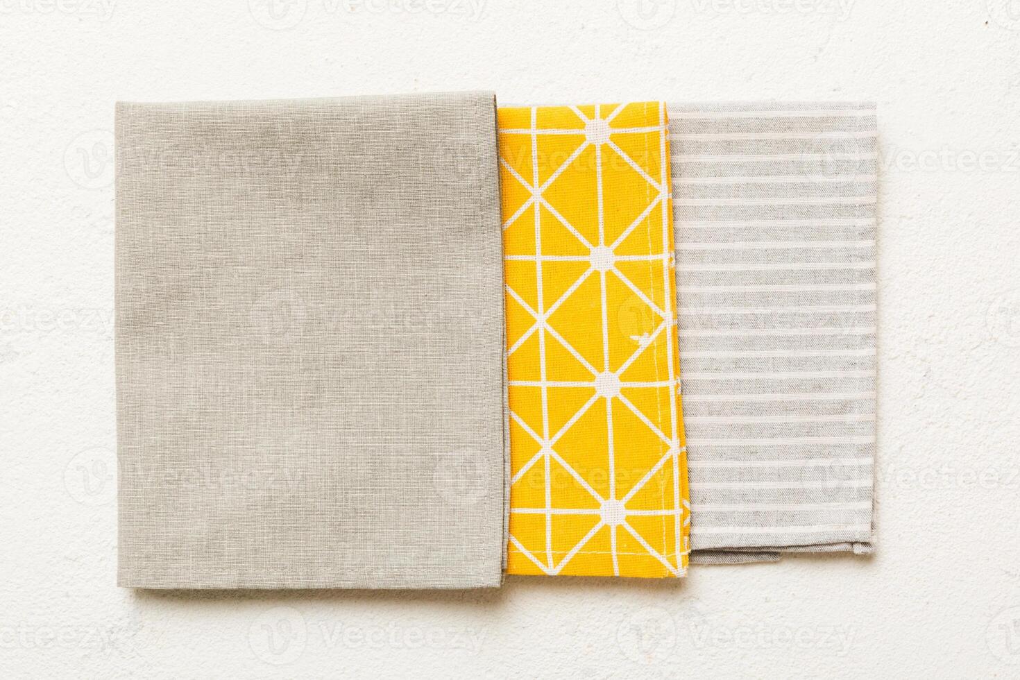top view with gray kitchen napkin isolated on table background. Folded cloth mockup with copy space, Flat lay. Minimal style photo