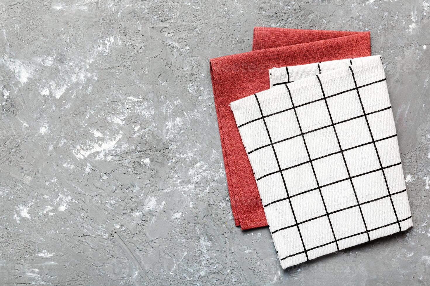 top view with white empty kitchen napkin isolated on table background. Folded cloth for mockup with copy space, photo