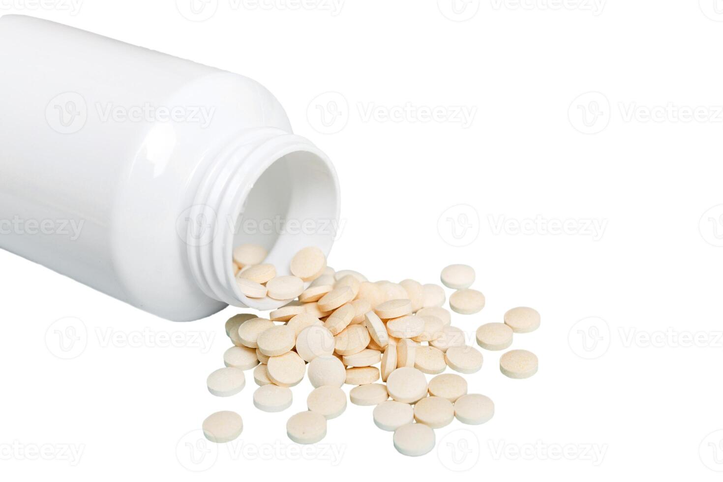 White medicines flow from container. medicine white pill bottle isolated on white background photo