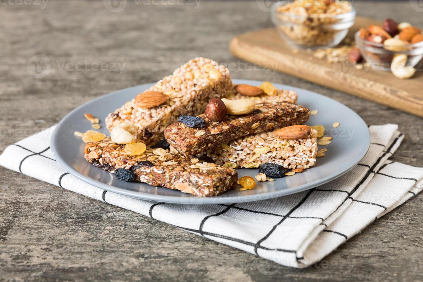 Various granola bars table background. Cereal granola bars. Superfood breakfast bars with oats, nuts and berries, close up. Superfood concept photo