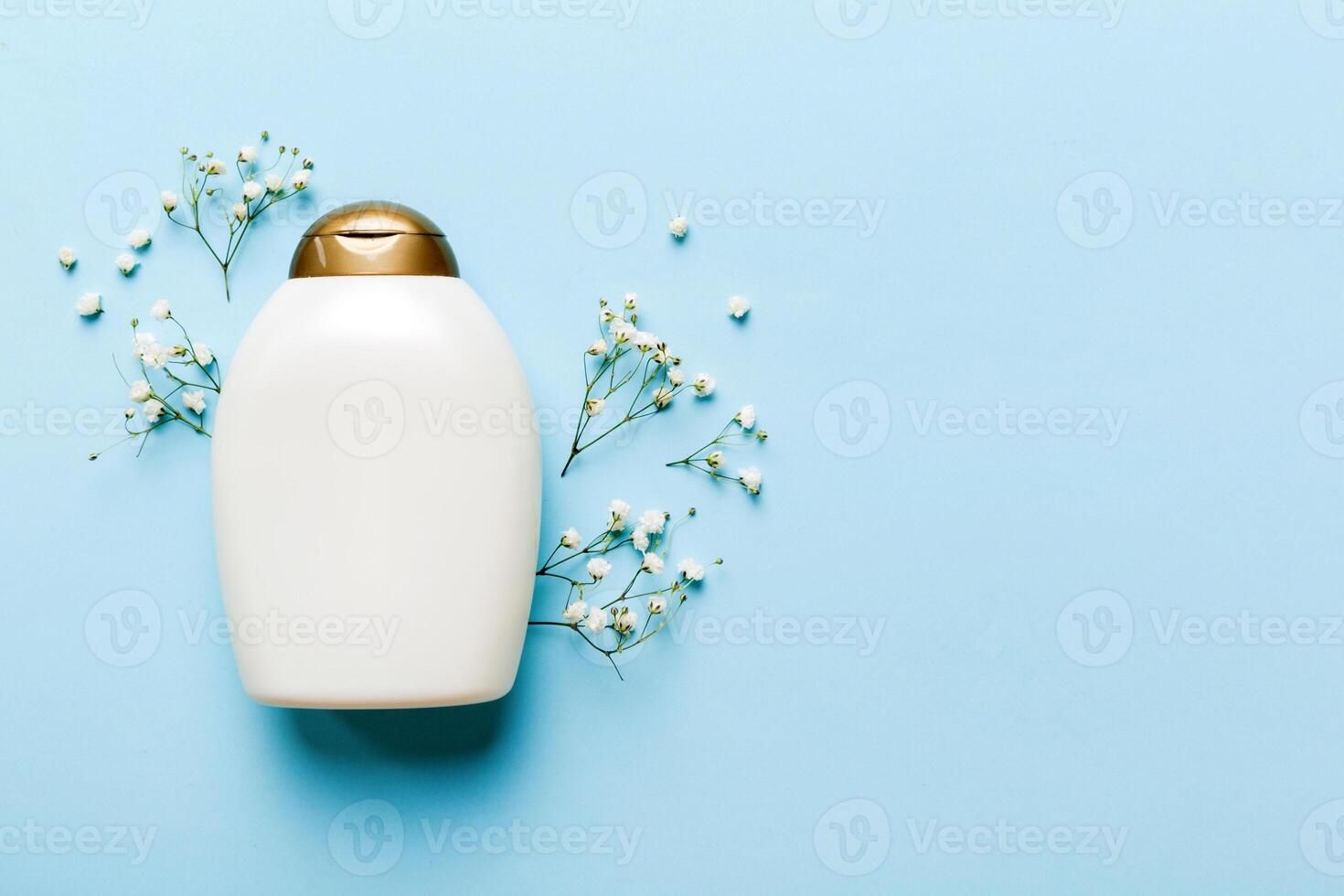 Fancy healthcare bottles cream with gypsophila branch. Natural oranic spa cosmetics concept. Mockup, template, Top view photo