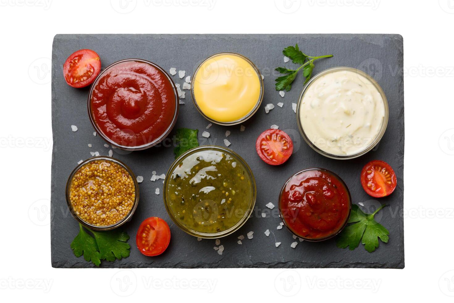 Many different sauces and herbs isolated white background, flat lay top view. sauces on plate, photo