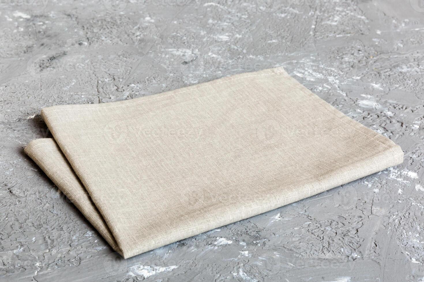 top view with gray kitchen napkin isolated table background. Folded cloth for mockup with copy space, Flat lay. Minimal style photo