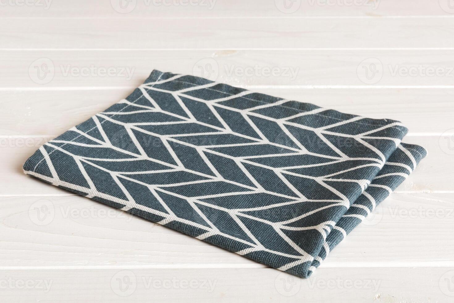 top view with blue kitchen napkin isolated table background. Folded cloth for mockup copy space, Minimal style photo