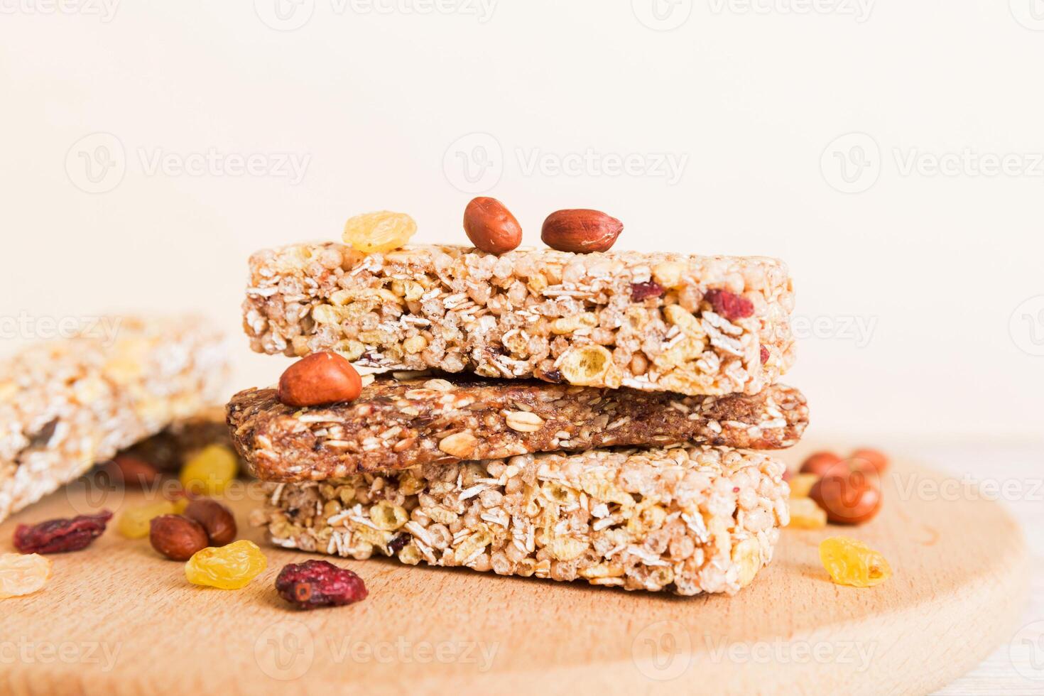 Various granola bars on table background. Cereal granola bars. Superfood breakfast bars with oats, nuts berries, close up. Superfood concept photo