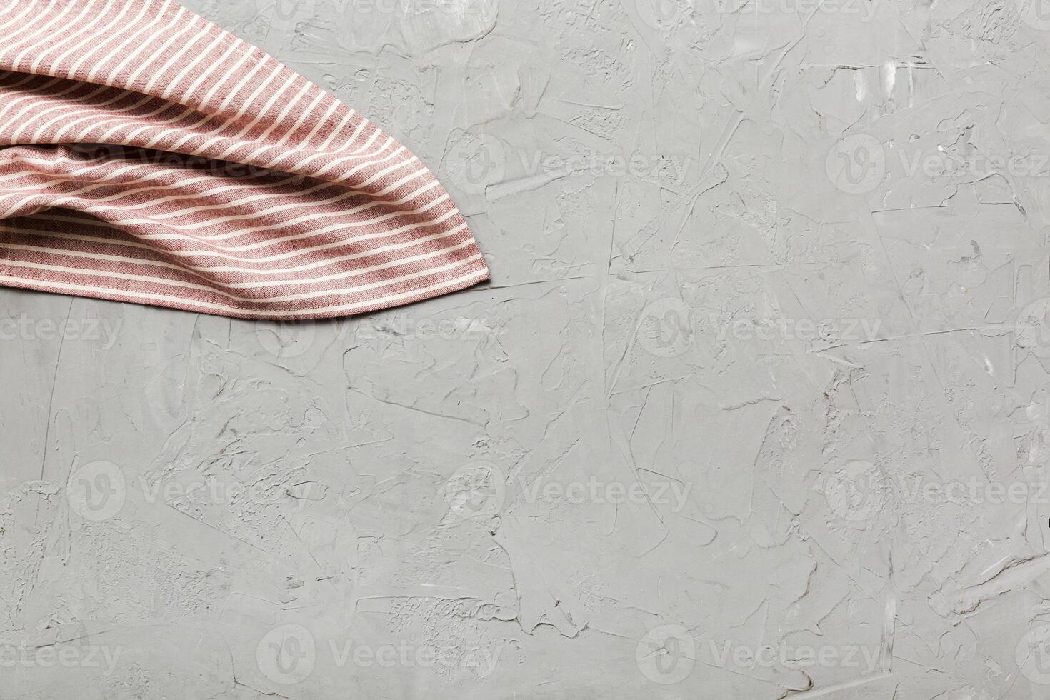 top view red empty kitchen napkin isolated on table background. Folded cloth mockup with copy space, Minimal style photo