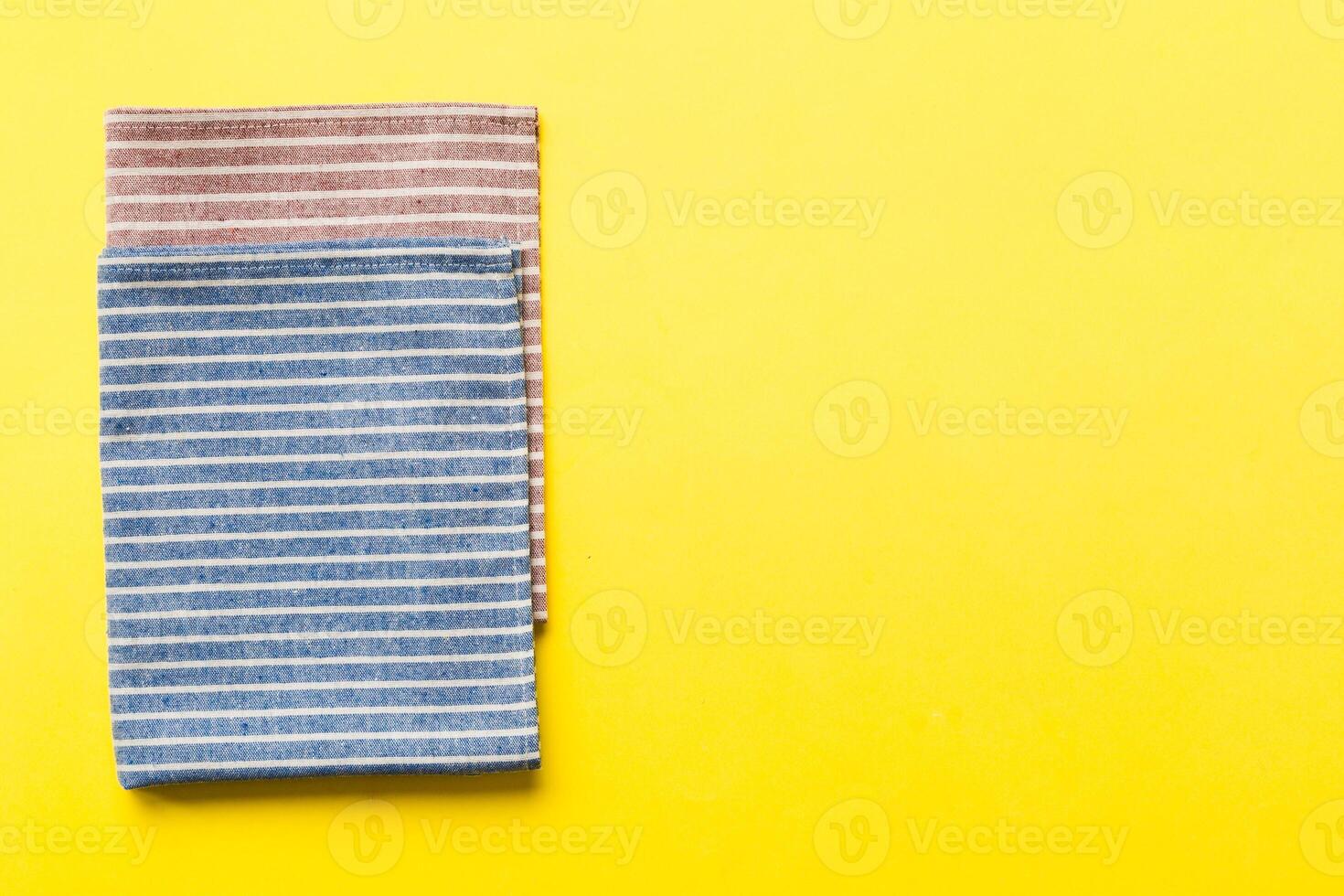 top view blue kitchen napkin isolated on table background. Folded cloth for mockup with copy space, Flat lay. Minimal style photo