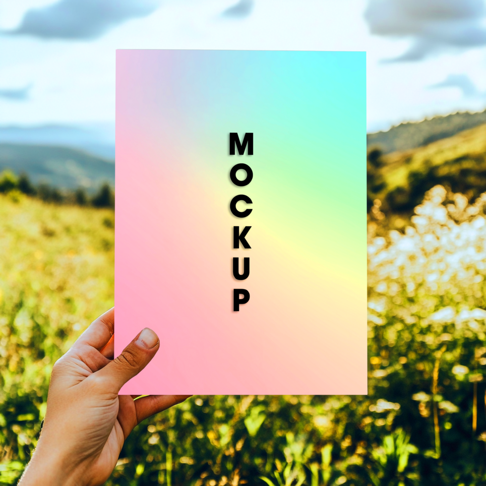 Pastel Gradient Mockup Hand Holding Paper in Nature Scene psd