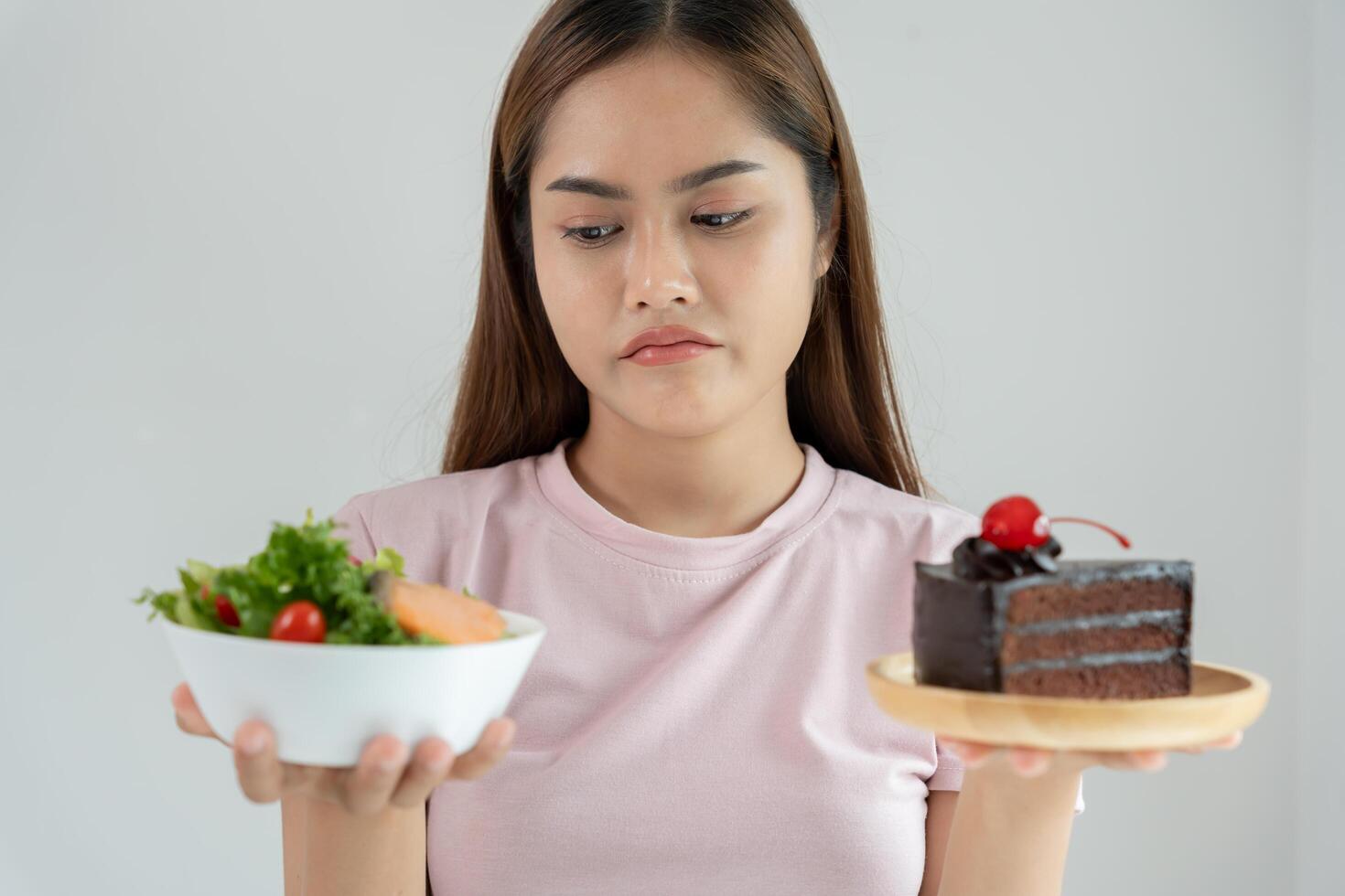 slim body asian women very bored diet food, dieting female choose low calories food for diet. Good healthy food. weight lose, balance, control, reduce fat routines, exercise, body shape photo