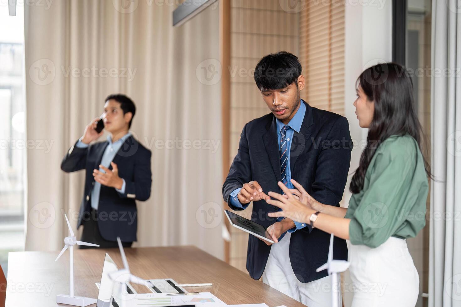 ESG sustainability teamwork discussion in modern office setting photo